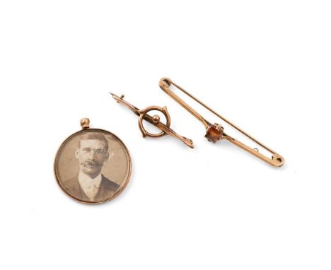 A 9ct gold bar brooch or stock pin set with emerald cut citrine, with 9ct gold pin, 2.8g, an Art Nouveau 9ct gold brooch of n
