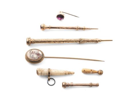 A group of three rolled gold decorative propelling pencils, comprising one set with a banded agate finial, one with citrine s