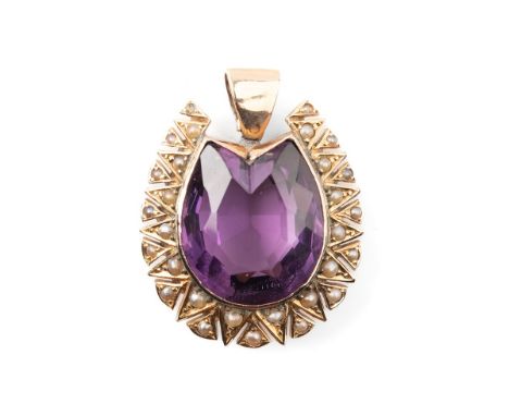 A Victorian 9ct gold, amethyst and seed pearl pendant, the large amethyst of horse shoe form, with seed pearls surrounding in