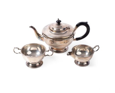 Hallmarked silver three-piece silver tea set to include a teapot, milk jug and sugar bowl, 621.8g, Birmingham 1937.