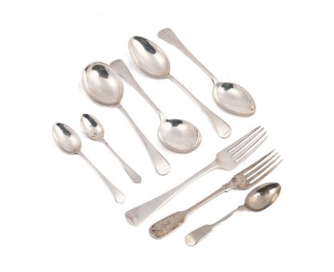 A collection of sterling silver flatware to include a Georgian fork, London 1809, and later examples such as soup spoons and 