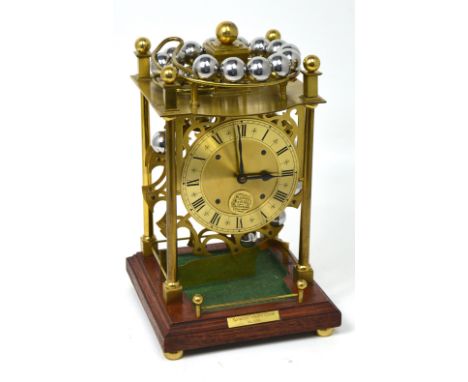 A 20th century lacquered brass Harding and Bazeley of Cheltenham spherical weight clock, the gilt chapter ring set with Roman