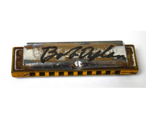 BOB DYLAN; a Hohner mouth organ signed in black pen to the front plate, 'Bob Dylan', length 10cm. CONDITION REPORT There is n