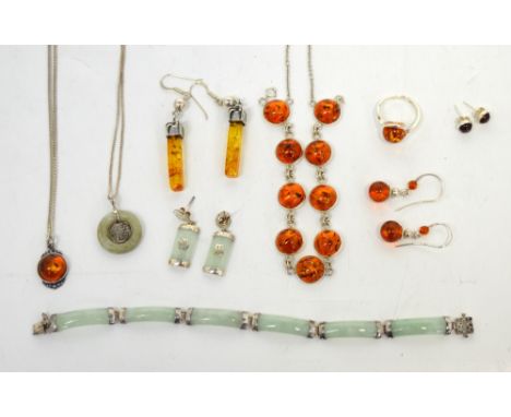 A quantity of amber and jade silver mounted jewellery to include necklaces, earrings, a bracelet and a ring.