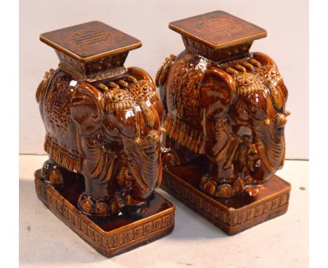 A pair of glazed brown ceramic Indian elephants, height of each 57cm.