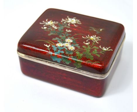 A Japanese silver and enamel rectangular box and cover with overpainted floral design to cover, silk lined interior, marks in