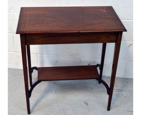 An Edwardian mahogany inlaid hall table with lower shelf on tapering supports, length 66cm.