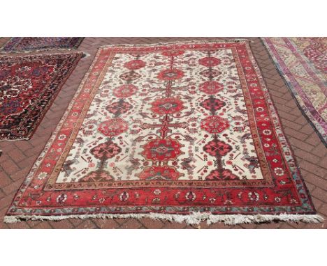 A vintage Persian Heriz carpet, 306 x 202cm.