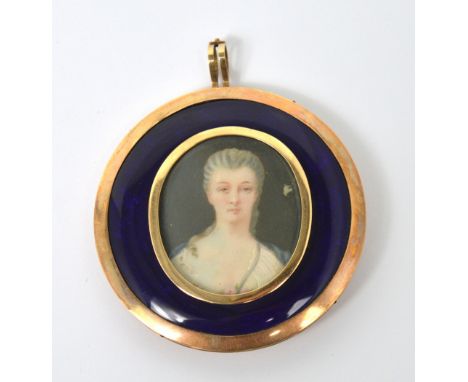 A 19th century French yellow metal mourning pendant with an oval portrait of a lady, the obverse having a lock of hair set be
