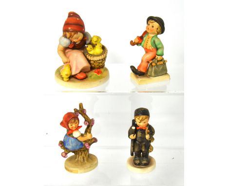 Four various Goebel figures and figure groups, the largest modelled as a seated girl with chicks, height 12cm, two figures ar