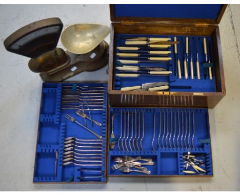 Walker & Hall, Sheffield; an oak cased part canteen of cutlery with three lift-out trays and a set of vintage Avery kitchen s