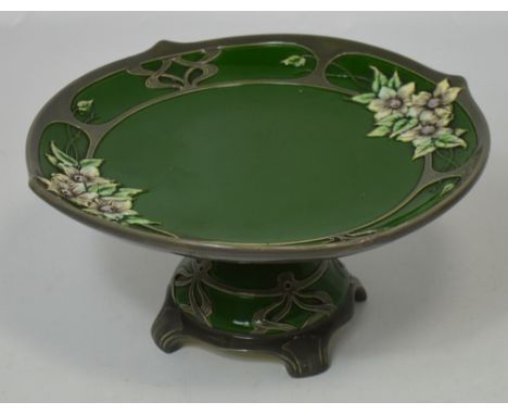An Austrian ceramic Art Nouveau style pedestal cake stand by Eichwald, pattern no.4543, with raised floral and faux silver de