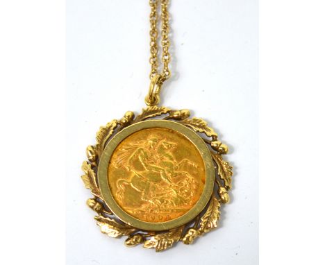 An Edward VII full sovereign, 1904, with hallmarked gold mount on 9ct gold chain, approx 15.2g.