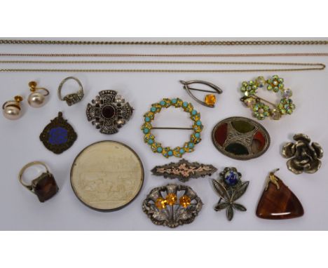 A quantity of brooches to include silver examples, a silver ring, further yellow metal and white metal chains and a medal for