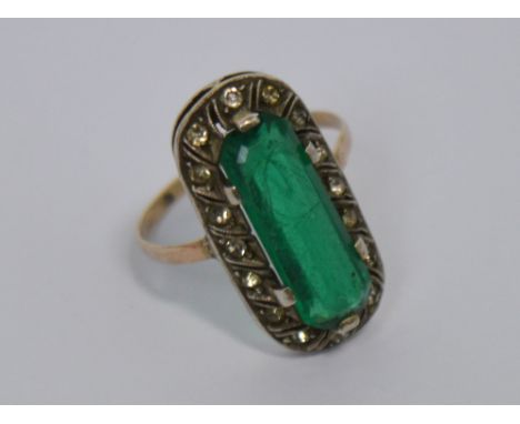 A white metal emerald and diamond set ring, size K, approx 3.2g.