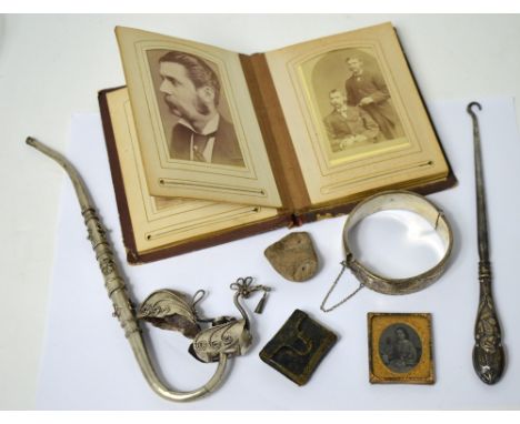 A collectors' lot comprising a hallmarked silver bangle, white metal pipe, hallmarked silver handled button hook, a miniature