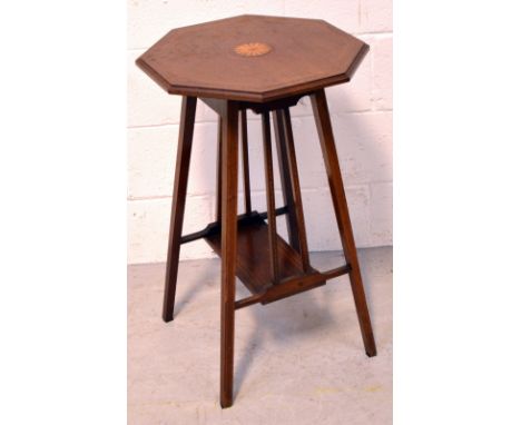 An Edwardian octagonal inlaid side table with lower shelf on splayed supports, height 70cm.