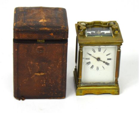 A 19th century cased brass carriage clock, the enamel dial set with Roman numerals, height 11cm.