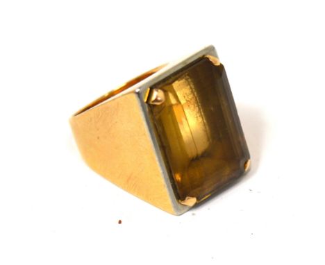 A yellow metal ladies' ring set with a smoky quartz, marks rubbed, size J, approx 13.3g.