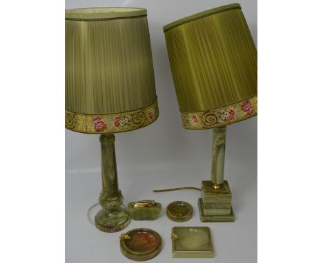 Two onyx table lamps with embroidered and pleated conical shades, three onyx ashtrays and an onyx Ronson table lighter (6).