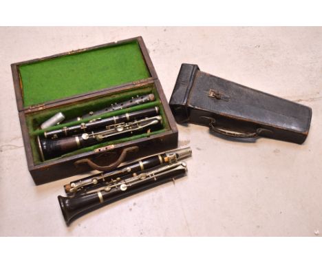 A cased Boosey & Co of London clarinet and a further wooden cased clarinet (2).