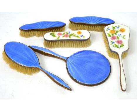 A four piece silver plated and blue guilloché enamel dressing table set and a two piece silver plated and enamel floral decor