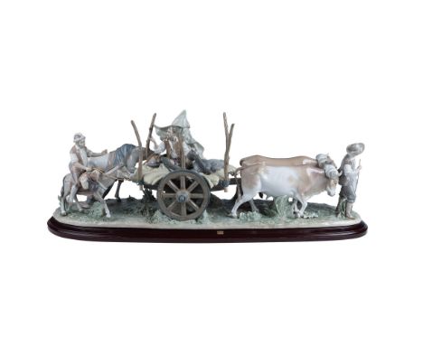 Glossy finish. Limited edition Don Quixote-inspired figure of a rustic cart with passengers, accompanied by oxen and a man gu