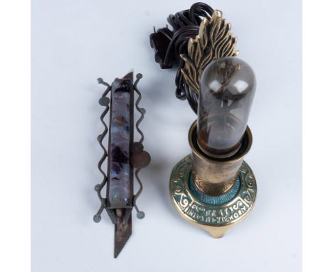 A classic Gary Rosenthal Mezuzah featuring a mostly purple fused glass center surrounded by fused pieces of brass and copper.