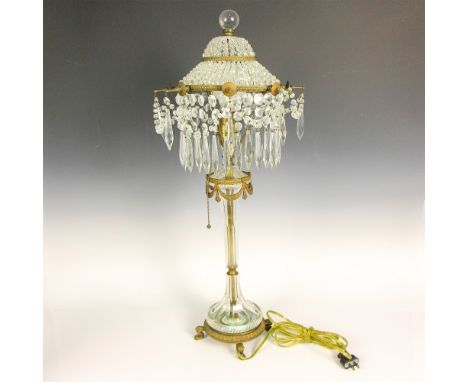 Globe finial atop bronze and crystal fringe. Cut glass body with bronze accents on bronze footed base. Chain pull switch. Dim