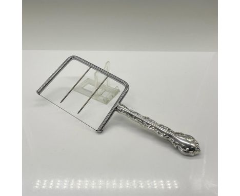 A decorative handle kitchen food utensil. Marked Schneider. Issued: 20th centuryDimensions: 9.25"L x 0.5"W x 3.25"HCondition: