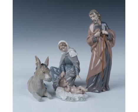 Glossy hand painted figures consisting of Joseph, Virgin Mary, Baby Jesus and a Mule laying down. Nao backstamp. Largest piec