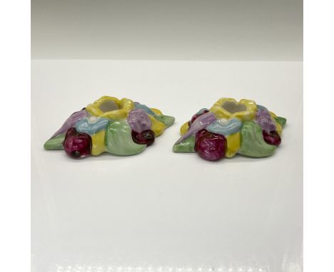 A rare pair of vintage Fulper Pottery candle holders. These beautiful pieces feature hand-painted floral designs. Issued: 20t