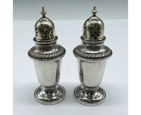 Unique footed design with thimble pierced top and embossed banded rim. Gorham Sterling engraved mark. 82 g. Issued: 20th cent