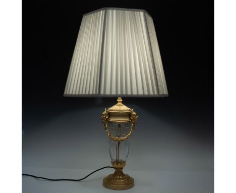 Stunning designed lamps with gilt bronze accent and cut crystal glass body. Rams' heads along with etched sash accent side an