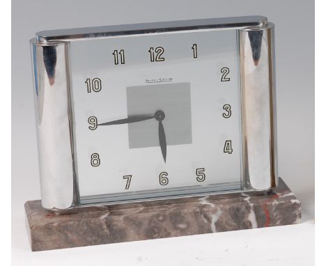 A 1930s Jaeger LeCoultre chrome cased mantel clock, having glazed dial and backplate, with eight day winding movement, signed