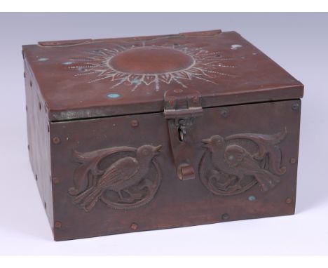 An Arts & Crafts embossed copper hinged top table casket by John Pearson, the cover decorated with stylised sun, with applied