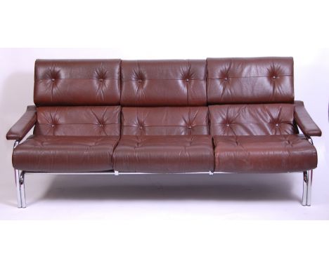 A 1970s Pieff tubular chrome framed and chocolate brown leather cushion upholstered three-seater sofa, having padded arms, w.