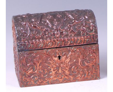 An Arts & Crafts embossed copper table-top casket, the domed cover opening to reveal floral lined interior, the whole decorat