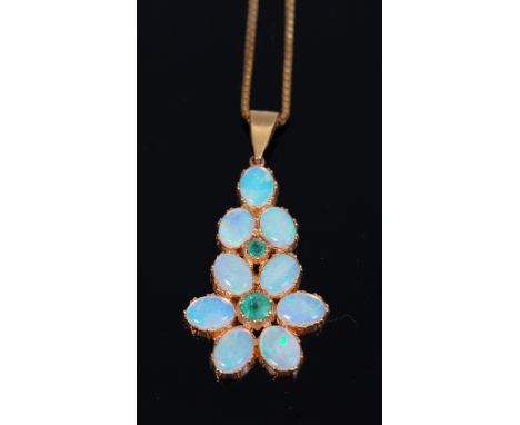 A contemporary 9ct gold cabochon opal and peridot set pendant, on 9ct gold fine link chain, pendant 4.5cm, chain length 22cm