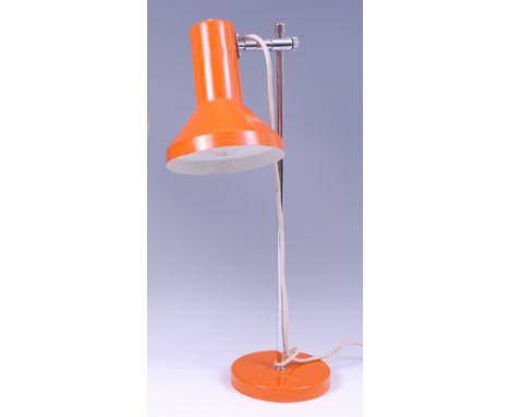 A 1980s Italian chrome and orange painted metal desk lamp, the integral height adjustable shade with switch to top, on circul