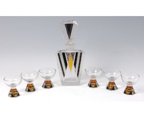 An Art Deco heavy clear crystal glass liqueur set, comprising decanter and stopper and six pedestal glasses, each with two-to