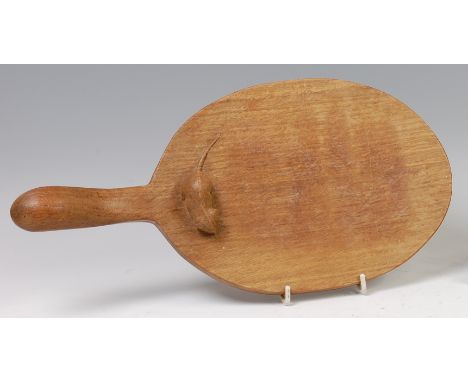 Robert 'Mouseman' Thompson - an oak cheeseboard, of oval form, with typical carved mouse towards base of raised handle, lengt