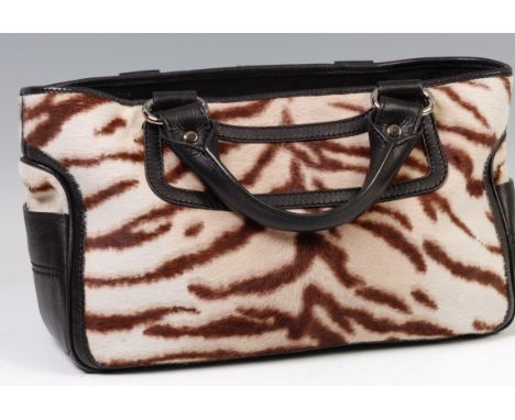 A Celine Lirine tiger print tote bag, having part black leather outer and inner lining, silvered metal hardware, with twin op