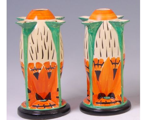A pair of Myott & Son Art Deco ceramic torpedo vases, the bright colour floral decoration painted in tones of orange and gree