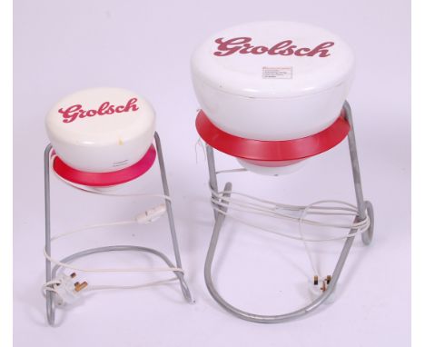 Two 1970s Grolsch advertising table lamps, each modelled as bottle stoppers, with removable covers, the largest h.44cm (2)   