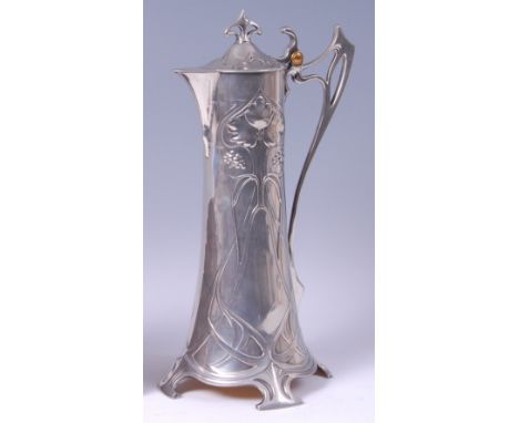 A WMF Art Nouveau pewter claret jug, the hinged cover with pierced stylised finial to further pierced and shaped handle, the 