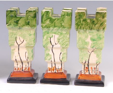 A set of three Myott & Son Art Deco ceramic castle vases, each of square stepped form, with raised block and wooded landscape
