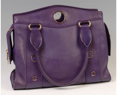 A Celine purple leather shoulder bag, having gilt metal hardware and two leather stitched handles, the long central zip enclo