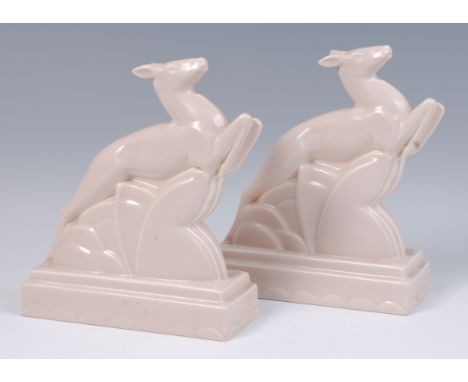 A pair of Poole Pottery Art Deco glazed book-ends, each modelled as leaping gazelles, each impressed 'Poole England' and numb