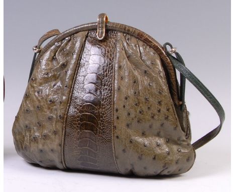A vintage crocodile skin handbag, having adjustable shoulder strap, gilt metal clasp and single zipped interior compartment, 